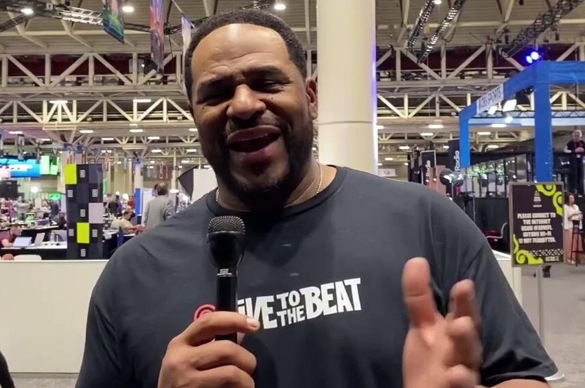 Jerome Bettis speaking to the camera wearing a Live to the Beat shirt